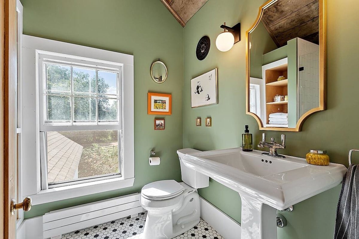 Modern bathroom design with an elegant white and grey palette, completed by Oxland Builders in New Hampshire